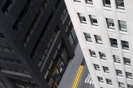 Street, black and white building facade from above at Manhattan