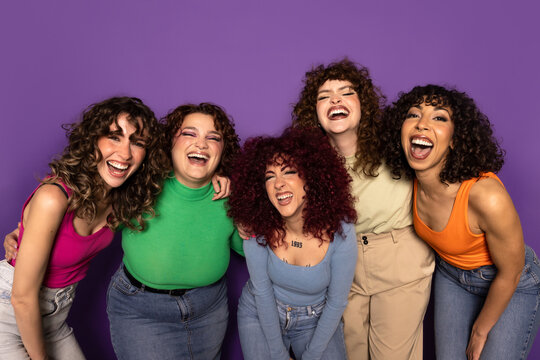 Group of friends laughing and enjoying a fun moment together