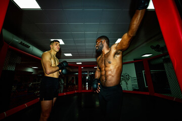 Boxing practice session in a training facility with two athletes