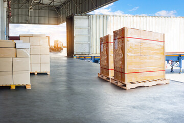 Bulk of Package Boxes Waiting to be Loaded into Containers Trucks. Distribution Shipping Cargo...