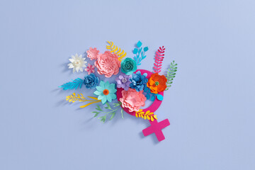 Gender symbol with flowers and leaves on pastel color background