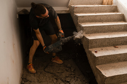 Construction Worker Using Power Tools for Home Renovation