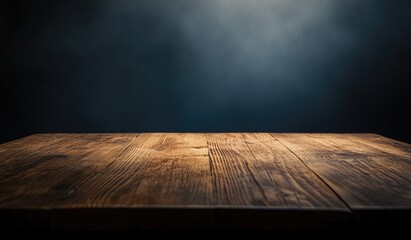Rustic wooden table top against a dark background (1)