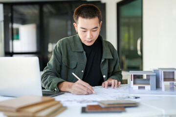 Obraz premium Architecture Man drawing on architectural Creative project business architecture building construction&nbsp;Industrial engineering Achievement Planning Design on eco blueprint
