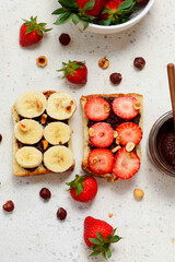 Brioche slices with homemade Nutella, strawberries and bananas