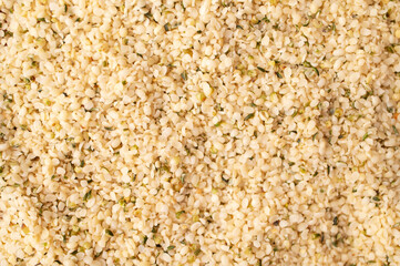 Close-up of peeled hemp seeds. Superfood, healthy tasty organic hemp seeds, source of omega 3 fatty acids, protein. Food background. Healthy food ingredient, smoothie