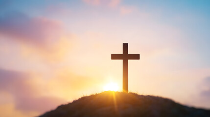 A cross atop a hill with a beautiful sunrise in the background, symbolizing peace, hope, and spirituality in a serene landscape.
