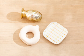 Copy space warm lighting background.Blank wallpaper with minimalist vase.Light and Shadow. Space for text.Backdrop.Studio photography.Sunshine. Chic style. Vase isolated on wooden. Home decor. Clean.