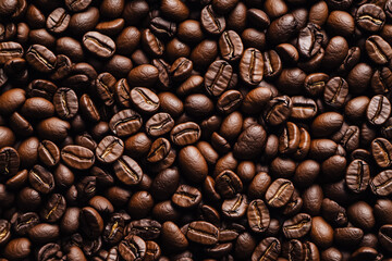 Naklejka premium top view background of roasted aromatic coffee beans