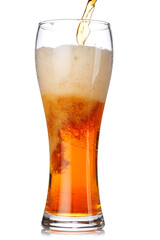 A glass of amber beer with frothy head, isolated on a clean white background