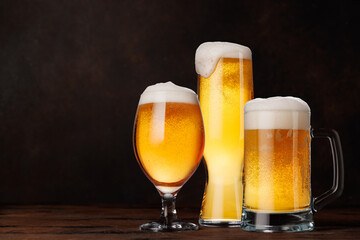 A glasses of beer with a golden hue and frothy head