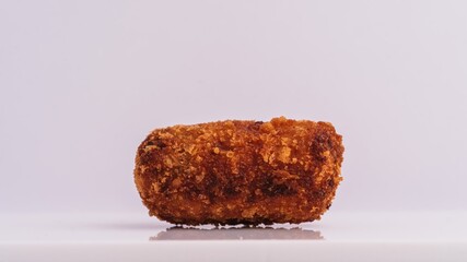 Golden Crispy Croquette of Iberico Ham on White Background