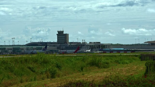 Slowmotion shot of a propellor plane landing at Tocumen International Airport