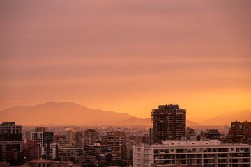 Fototapeta premium Beautiful view to sunset and buildings in Santiago, Chile