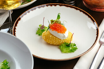 poached egg with cutlet and caviar