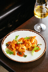 flatbread with shrimp and a glass of wine