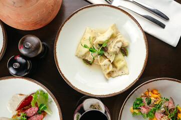 ravioli with herbs and sauce in a restaurant