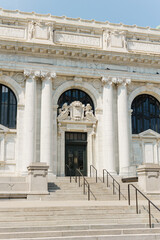 Fototapeta premium Public library entrance with marble columns and carved details.