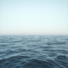 Obraz premium Vast blue ocean under a clear sky with gentle waves and horizon in the background