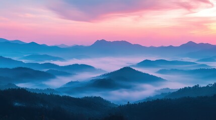 Mountain range with pink sky and sunset over scenic lychee orchard landscape and rolling hills in the background