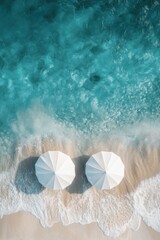 Fototapeta premium Aerial Serenity Two White Umbrellas on Sandy Beach Meeting Turquoise Ocean Waves Relaxing Tropical Escape