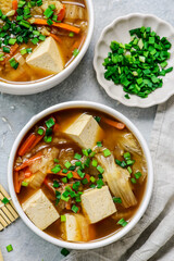 Traditional Japanese Miso Soup with Chinese Cabbage and Tofu in bowls .style hugge