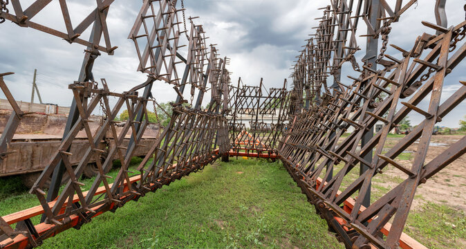 Tooth harrow (Double row tooth harrow hitch) waiting for work
