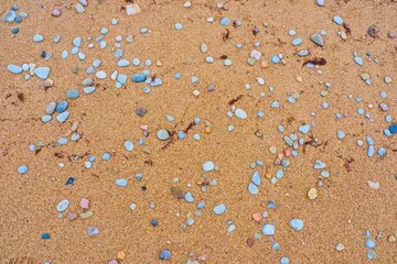 Sandy beach. Coarse sand. Summer beach background. Ecology.