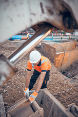 Construction worker working on a public city road reconstruction