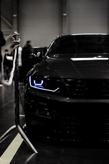 Headight of a black car. Blue headlight.