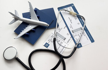 international medical travel insurance concept, stethoscope, passport and airplane isolated on...