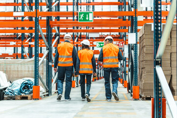 Warehouse workers walking in logistics center