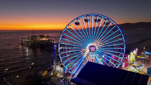 Santa Monica Pier at Sunset with Illuminated Ferris Wheel and Carnival, October 10, 2024