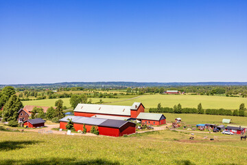 View at a farm with red barns in the swedish countryside © Lars Johansson