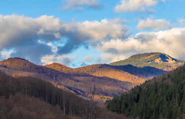 Mountain landscape with clouds in Sovata resort area - Romania, Gurghiu mountains