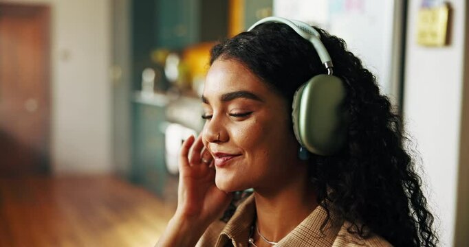 Home, smile and woman with headphones, listening to music and dancing in lounge. Apartment, energy and person with headset, audio and sound with break, relaxing and radio with positive mindset