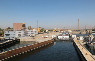 Obraz premium View of cruise ship pass through the Esna Lock on the River Nile, Egypt