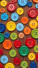 Fototapeta premium Bright Multicolored Sewing Buttons in Various Sizes Arranged on Wooden Background – Perfect for Crafting and Creative Ideas