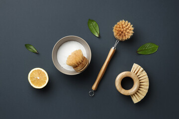 Eco friendly cleaning products and brushes on grey background. Flat lay eco cleaning products. Cleaner concept.