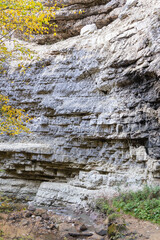Kabardino-Balkaria. Chegem Nature Reserve. Autumn 2024. Stormy and foaming transparent waters of mountain river Adai-Su flow among sheer cliffs, stones and boulders created by nature.