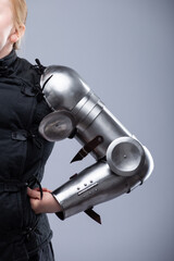 Fototapeta premium Polished Steel Medieval Arm Armor with Elbow Protection. Shiny and detailed gauntlets designed to protect the forearm and elbow in historical combat.