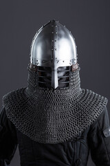 Simple Medieval Knight's Nasal Helmet with Chainmail. Classic head protection featuring a central nose guard and attached chainmail collar.
