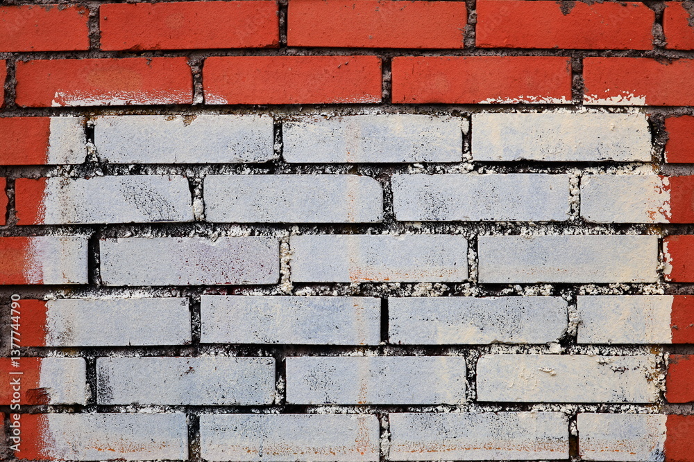 Aufkleber A red and white brick wall with a white border, ideal for use in design projects requiring a bold and contrasting element.