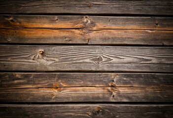 Obraz premium A close up of a wooden wall with knots.