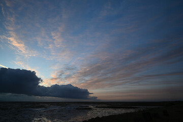 sunrise with clouds over the beach