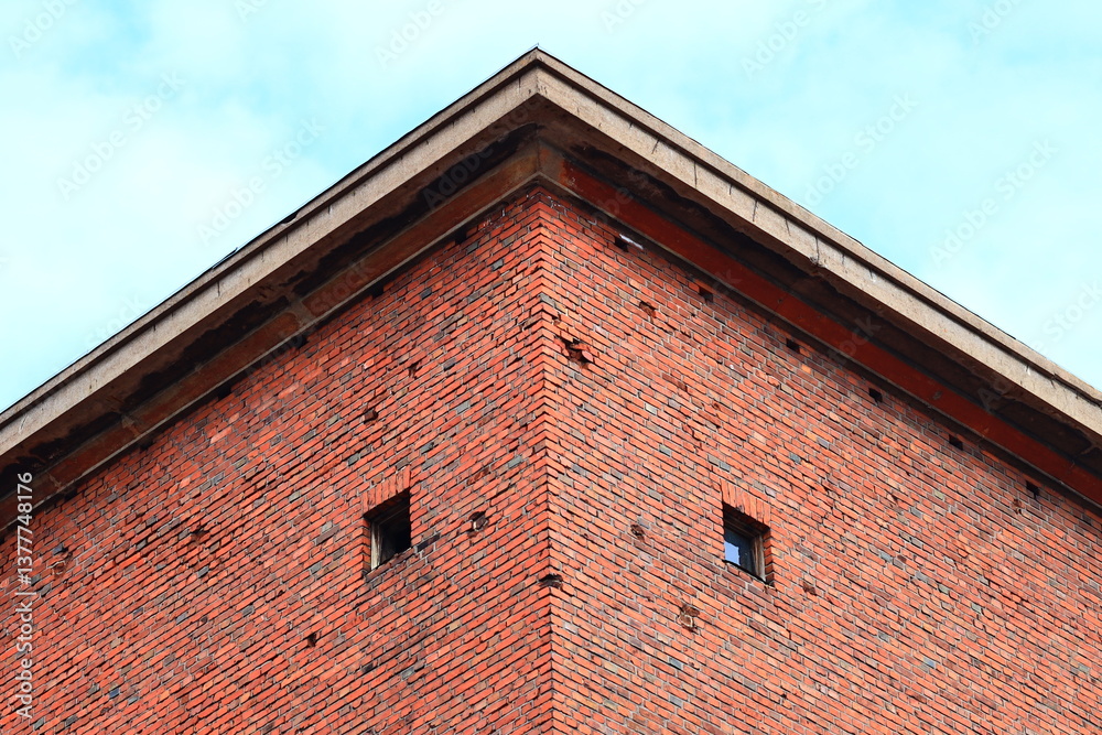 Poster a historic-style building with a prominent clock on its exterior wall, perfect for use in historical