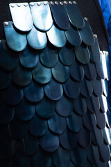 Close-up of Byzantine Lamellar Armor Scales. Detailed view of overlapping metal plates on medieval scale armor.