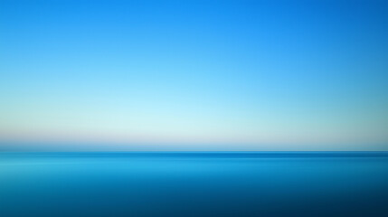 Minimalist seascape with smooth blue gradient sky at dusk