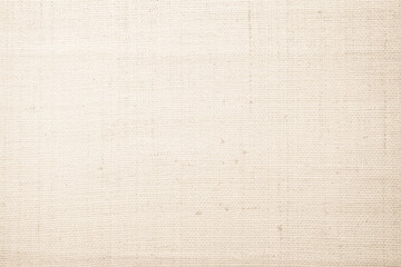Fototapeta premium Brown sackcloth woven texture background in natural pattern. Jute hessian burlap, linen background in light beige cream color blank. Weaving canvas fiber line cotton cloth textured as organic.