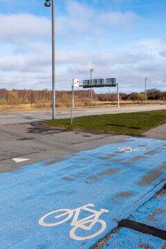 Bike symbol on a blue parking zone in &Oslash;restad, Copenhagen, Denmark. Captured on a quiet afternoon with minimalist lines, urban elements and isolated design context.